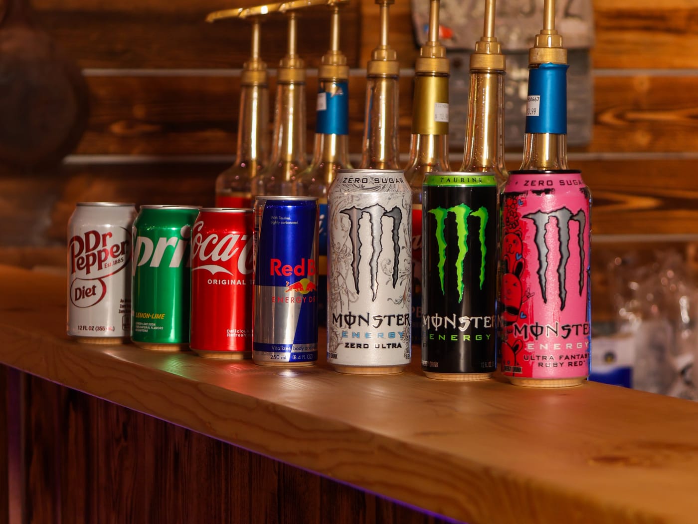 Soda bar with Coca-Cola, Dr Pepper, Red Bull, and Monster Energy cans